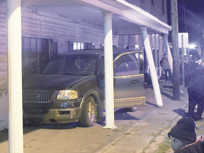 SUV crashes into building before parade